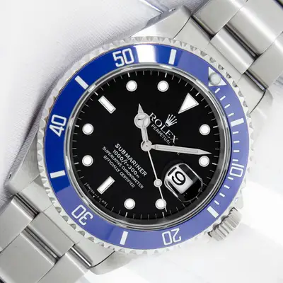 Rolex ROLEX SUBMARINER DATE STAINLESS STEEL WATCH WITH BLACK INDEX DIAL BLUE INSERT