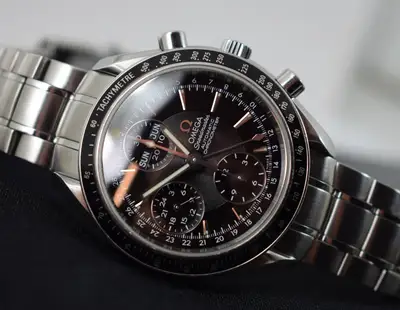 Omega omega speedmaster triple date . model 3220.50.00 box manual 1 yr gtee