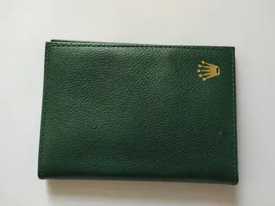 Rolex Rolex Sea dweller green leather wallet and contents