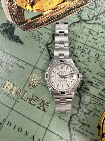 Rolex Oyster Perpetual Date Diamond Bezel