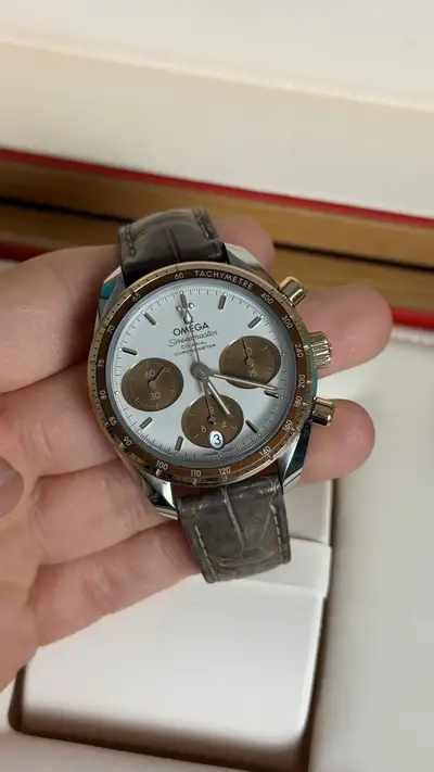 Omega Speedmaster Co-Axial Sedna Gold Card