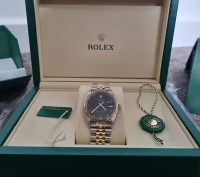 Rolex Oyster Perpetual Date 14k Gold+SS