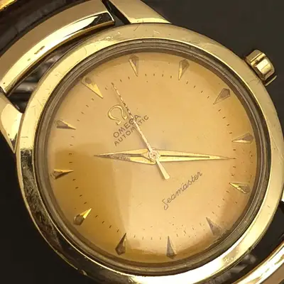 Omega RP9: ROOTBEER OMEGA SEAMASTER 14k GOLD