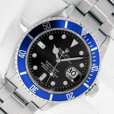 Rolex ROLEX SUBMARINER DATE STAINLESS STEEL WATCH WITH BLACK DIAMOND DIAL BLUE INSERT