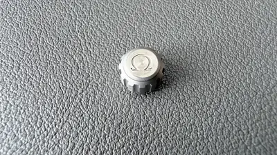 Omega titanium crown for the Speedmaster