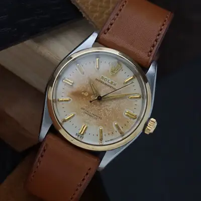 Rolex Oyster Perpetual 6564 Steel/18k Gold
